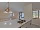 Modern kitchen with white cabinets and island at 102 Shoreview Ln, Oldsmar, FL 34677