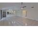 Bright living room with tile floors and a ceiling fan at 102 Shoreview Ln, Oldsmar, FL 34677