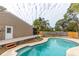 Refreshing kidney-shaped pool with surrounding patio at 102 Shoreview Ln, Oldsmar, FL 34677