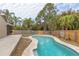 Relaxing kidney-shaped pool surrounded by lush landscaping at 102 Shoreview Ln, Oldsmar, FL 34677