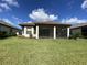 Single-story home with screened patio and manicured lawn at 10912 Wicker Park Pl, Palmetto, FL 34221