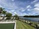 Tranquil lakefront view with seating at 10912 Wicker Park Pl, Palmetto, FL 34221