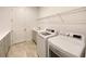 Laundry room with washer, dryer, and ample counter space at 10912 Wicker Park Pl, Palmetto, FL 34221