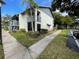 Exterior view of condo building, showing building and landscaping at 11201 122Nd Ave # 217, Largo, FL 33778