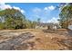 Spacious backyard with mature trees and open space at 12575 Maleo Rd, Weeki Wachee, FL 34614