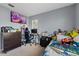 Bedroom with double bed, workspace, and lots of toys at 12575 Maleo Rd, Weeki Wachee, FL 34614