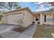 Exterior view of house with attached garage and walkway leading to front door at 12575 Maleo Rd, Weeki Wachee, FL 34614