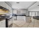 Kitchen with white cabinets, stainless steel appliances, and an island at 12575 Maleo Rd, Weeki Wachee, FL 34614