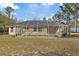 Home with refreshing pool and screened enclosure at 12575 Maleo Rd, Weeki Wachee, FL 34614