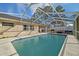 Inviting screened-in pool with patio area at 12575 Maleo Rd, Weeki Wachee, FL 34614