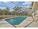 Relaxing screened-in pool with ample surrounding deck space at 12575 Maleo Rd, Weeki Wachee, FL 34614