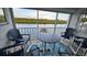Balcony with water view and outdoor seating at 18325 Gulf Blvd # 407, Redington Shores, FL 33708
