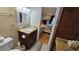 Bathroom with granite vanity, toilet and view of bedroom at 18325 Gulf Blvd # 407, Redington Shores, FL 33708