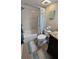Bathroom with tub, shower, and coastal-themed decor at 18325 Gulf Blvd # 407, Redington Shores, FL 33708