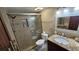 Updated bathroom with granite vanity, large shower, and tiled floors at 18325 Gulf Blvd # 407, Redington Shores, FL 33708