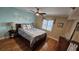 Bedroom with coastal decor, hardwood floors, and ample light at 18325 Gulf Blvd # 407, Redington Shores, FL 33708