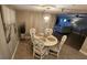 Charming dining area with round table and four chairs at 18325 Gulf Blvd # 407, Redington Shores, FL 33708