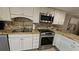 Updated kitchen boasts granite countertops and stainless steel appliances at 18325 Gulf Blvd # 407, Redington Shores, FL 33708