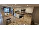 Modern kitchen with granite island and stainless steel appliances at 18325 Gulf Blvd # 407, Redington Shores, FL 33708