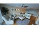 Bright living room features comfy leather sofas, a large area rug, and hardwood floors at 18325 Gulf Blvd # 407, Redington Shores, FL 33708