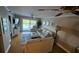 Living room features hardwood floors, comfy seating, and water views at 18325 Gulf Blvd # 407, Redington Shores, FL 33708