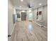 Condominium lobby with wood-look floors and an elevator at 18325 Gulf Blvd # 407, Redington Shores, FL 33708