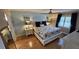 Main bedroom with a comfortable bed, nightstands, and hardwood floors at 18325 Gulf Blvd # 407, Redington Shores, FL 33708