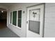 Condo entry with a white door and window at 2002 Australia E Way # 38, Clearwater, FL 33763