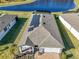 Aerial view showcasing home, solar panels and backyard at 20108 Sea Glass Cir, Land O Lakes, FL 34638