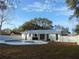Inviting backyard with a refreshing pool and a metal roofed patio at 214 W 109Th Ave, Tampa, FL 33612