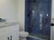 Bathroom with blue marble shower and white vanity at 214 W 109Th Ave, Tampa, FL 33612