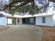 Charming single story home with a covered carport and blue front door at 214 W 109Th Ave, Tampa, FL 33612