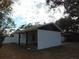 Newly renovated home with carport and white exterior at 214 W 109Th Ave, Tampa, FL 33612