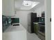 Modern kitchen with teal tile backsplash and stainless steel appliances at 214 W 109Th Ave, Tampa, FL 33612