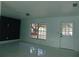 Living room with large window and shiny floors at 214 W 109Th Ave, Tampa, FL 33612