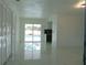 Bright living room with pool view and shiny floors at 214 W 109Th Ave, Tampa, FL 33612
