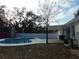 Backyard oasis with pool, patio, and red barn shed at 214 W 109Th Ave, Tampa, FL 33612