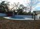 Inviting kidney-shaped pool in a fenced backyard at 214 W 109Th Ave, Tampa, FL 33612