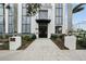 Modern building entrance with walkway and landscaping at 226 5Th N Ave # 1106, St Petersburg, FL 33701