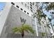 Modern building exterior with gray stone and palm trees at 226 5Th N Ave # 1106, St Petersburg, FL 33701