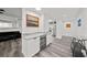 Modern kitchen with white cabinetry and wine cooler at 226 5Th N Ave # 1106, St Petersburg, FL 33701