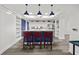 Modern kitchen with breakfast bar and blue cabinetry at 226 5Th N Ave # 1106, St Petersburg, FL 33701