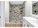 Modern bathroom with a large walk-in shower and marble tile at 2267 Heron Cir, Clearwater, FL 33762