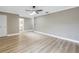 Bright bedroom featuring a ceiling fan and an ensuite bathroom at 2267 Heron Cir, Clearwater, FL 33762