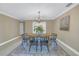 Elegant dining room with a wooden table and chandelier at 2267 Heron Cir, Clearwater, FL 33762