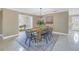 Bright dining room with wooden table and a view of office at 2267 Heron Cir, Clearwater, FL 33762