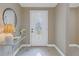 Bright entryway with glass-paned door and console table at 2267 Heron Cir, Clearwater, FL 33762
