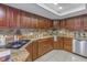 Granite countertop kitchen with ample cabinetry and stainless steel appliances at 2267 Heron Cir, Clearwater, FL 33762