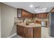 Kitchen features granite countertops and dark wood cabinets at 2267 Heron Cir, Clearwater, FL 33762