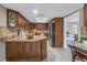 Spacious kitchen with granite countertops, dark wood cabinets, and stainless steel appliances at 2267 Heron Cir, Clearwater, FL 33762